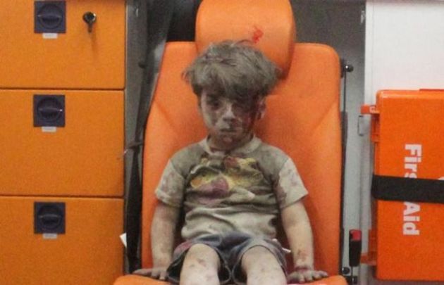 Heartbreaking footage of five-year-old boy dazed and bloodied after airstrike highlights horror of Syria's civil war