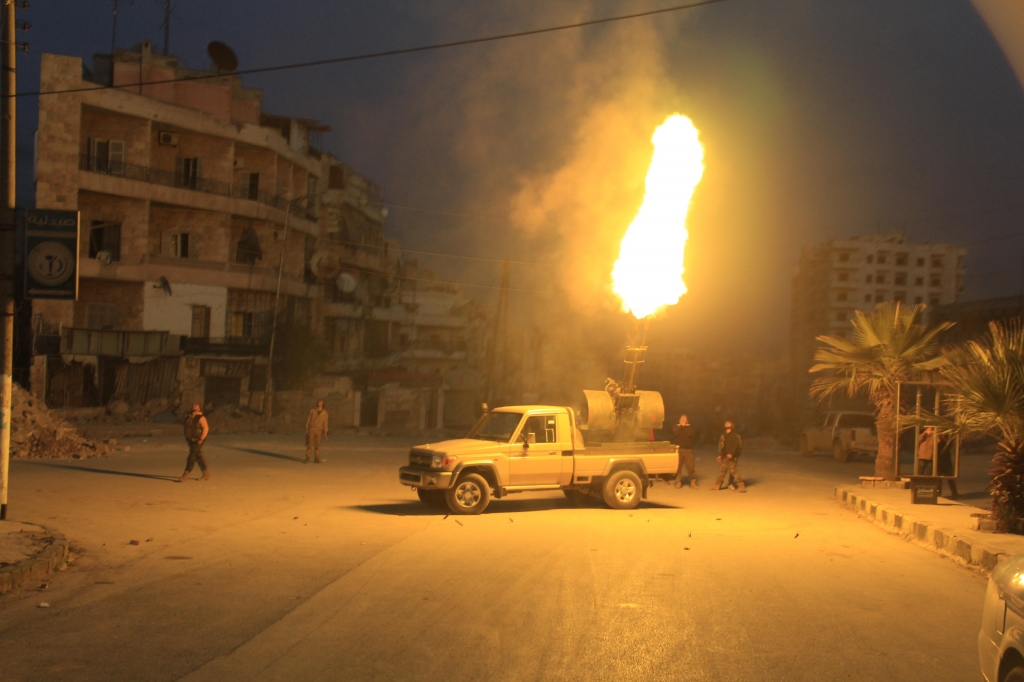 Syrian rebels use a track mounted heavy machine gun against Russian bombers in Aleppo Louai Barakat  Alamy