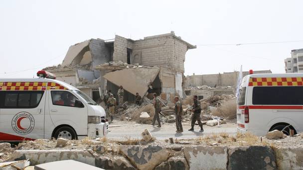 Syrian soldiers are seen at the entrance of Daraya a blockaded Damascus suburb