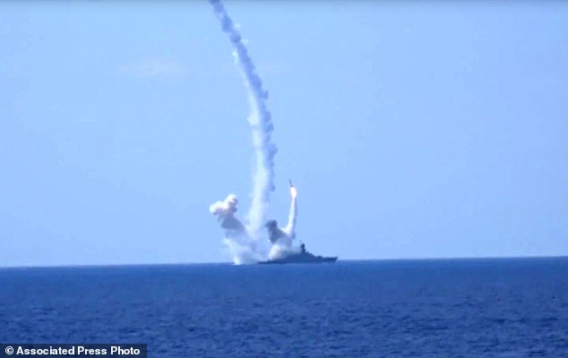 In this frame grab provided by Russian Defense Ministry press service long-range Kalibr cruise missiles are launched by a Russian Navy ship in the eastern Mediterranean