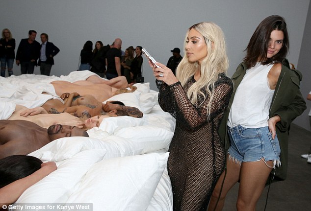 Taking a look Kendall struck a pose as Kim took pictires of the waxworks used by her rapper husband in his Famous video