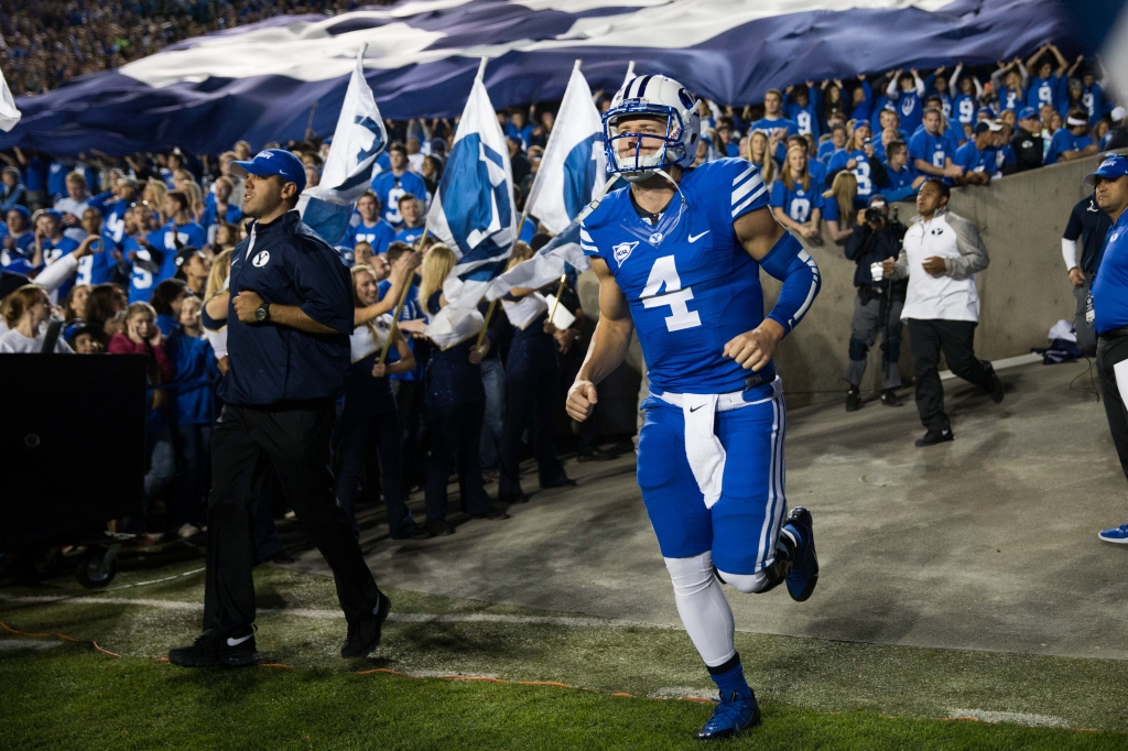 Taysom Hill takes the field for warmups against Utah State on Oct. 3 2015