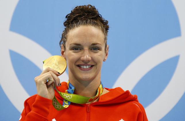 Katinka Hosszu of Hungary poses with her gold medal on the podium