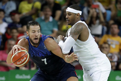 France's Joffrey Lauvergne left drives around United States Carmelo Anthony right during a basketball game at the 2016 Summer Olympics in Rio de Janeiro Brazil Sunday Aug. 14 2016