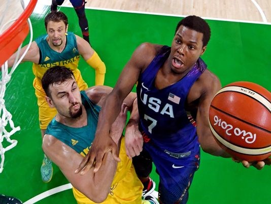 Team USA's Kyle Lowry shoots against Australia center Andrew Bogut