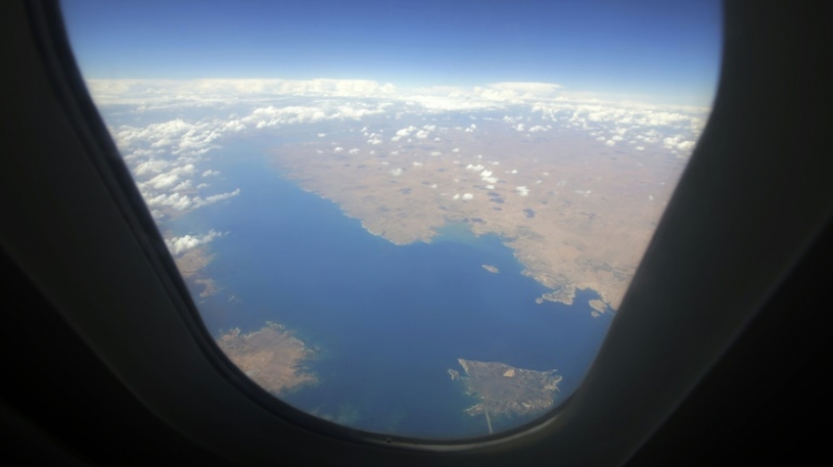 The Euphrates river is seen from the window of a passenger plane as it flies over the dam of Raqa in northern Syria in 2013