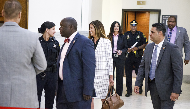 Pennsylvania Attorney General Kathleen Kane center walks into the courtroom on the second day of her trial at the Montgomery County Courthouse Tuesday Aug