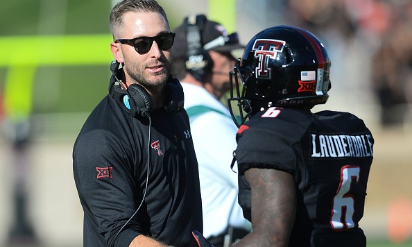 LUBBOCK TX- OCTOBER 31 Head coach Kliff Kingsbury of the Texas Tech Red Raiders congratulates Devin Lauderdale #6 of the Texas Tech Red Raiders during the game against the Oklahoma State Cowboys