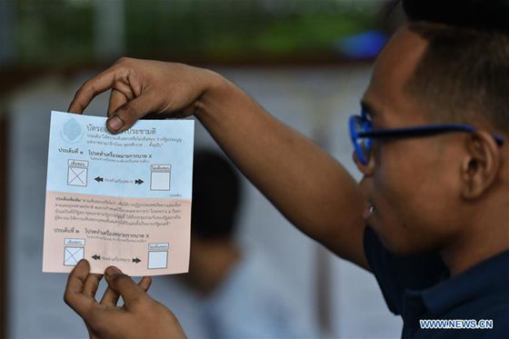 A staff counts ballot at a polling station after Thailand's constitutional referendum ends in downtown Bangkok Thailand on Aug. 7 2016