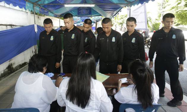 Thai soldiers queue up to vote in a referendum on a new constitution at a polling station in Bangkok Thailand Sunday Aug. 7 2016. Thais voted Sunday in a referendum on a new constitution that critics say is tailor-made for the military government to