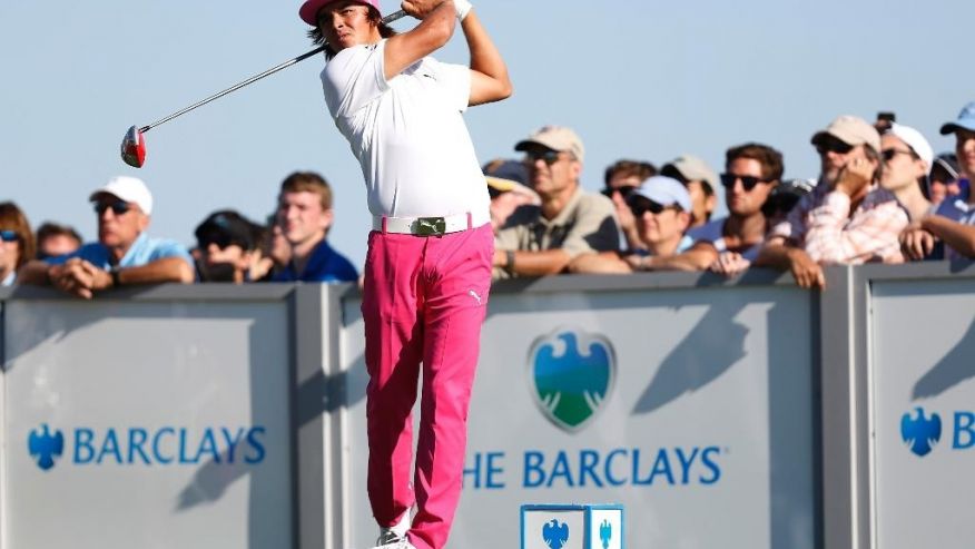 Rickie Fowler hits a tee shot on the 17th hole during the third round of The Barclays golf tournament in Jersey City N.J. So much more is at stake than $69 million in prize and bonus money during the Fed Ex Cup. T