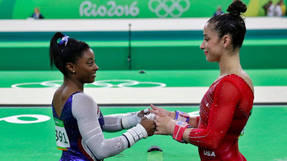 United States Simone Biles left and Aly Raisman encourage each other during the artistic gymnastics women's individual all-around final at the 2016 Summer Olympics in Rio de Janeiro Brazil Thursday Aug. 11 2016