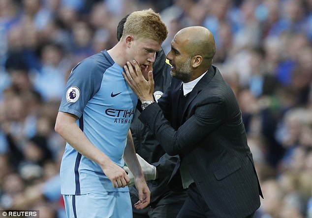 The Spaniard takes a hands-on approach as he delivers instructions to Kevin De Bruyne