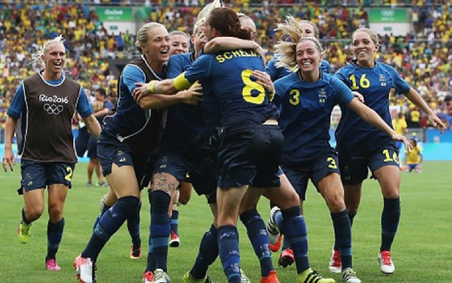 The Swedish team celebrate their win over Brazil