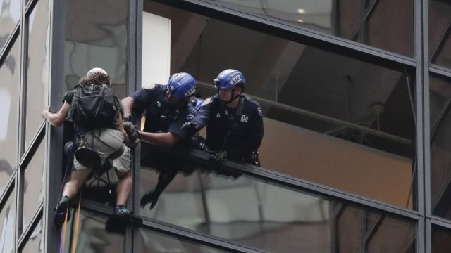 Man is trying to scale Trump Tower in NYC using suction cups