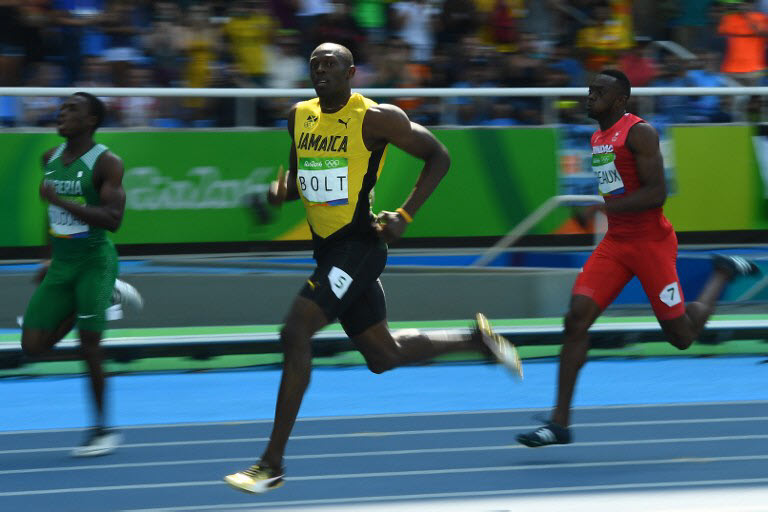 Jamaica's Usain Bolt competes in the Men's 200m Round 1 during the athletics competition