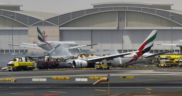 The remnants of the Emirates airliner on the runway in Dubai