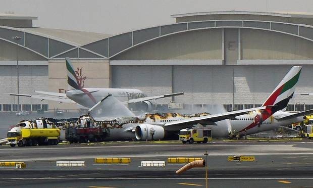 The smouldering wreckage of the Emirates plane at Dubai airport