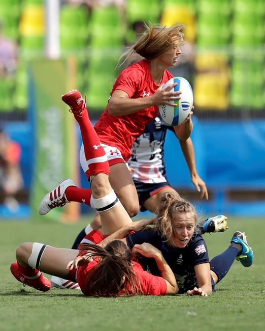 Canada's Megan Lukan top attacks during the women's rugby sevens match against Britain at the Summer Olympics in Rio de Janeiro Brazil Sunday Aug. 7 2016. THE CANADIAN PRESS  AP Themba Hadebe