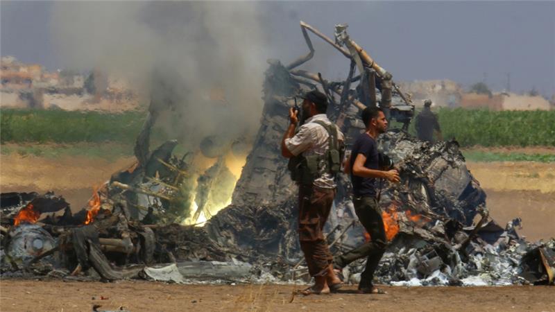 The wreckage of a Russian helicopter that had been shot down in the north of Syria's rebel-held Idlib province August 1