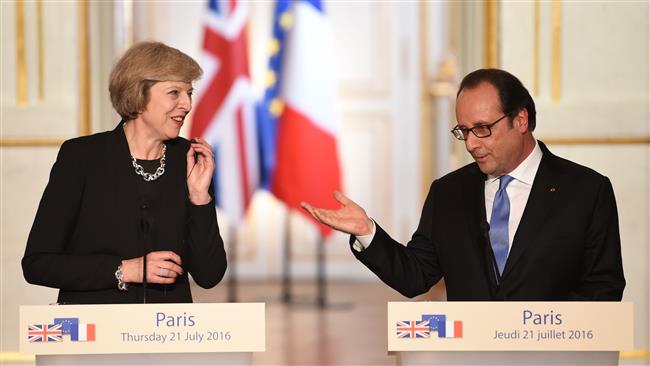 French President François Hollande speaks next to British Prime Minister Theresa May during a joint press conference