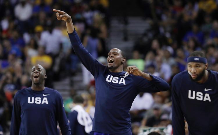 From left United States&#39 Draymond Green Kevin Durant and De Marcus Cousins celebrate after a score by Carmelo Anthony during the second half of an exhibition basketball game against China on Tuesday