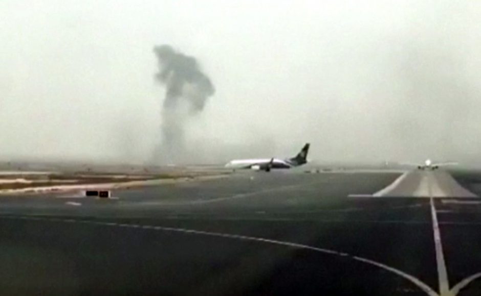 This image made from video shows smoke rising after an Emirates flight crash landed at Dubai International Airport on Wednesday Aug. 3 2016. Pic AP