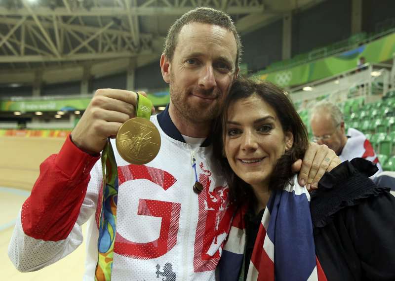 2016 Rio Olympics- Cycling Track- Victory Ceremony- Men's Team Pursuit Victory Ceremony- Rio Olympic Velodrome- Rio de Janeiro Brazil- 12/08/2016. Bradley Wiggins of Britain holds his gold medal and poses with his wife Catherine. REUTERS  Matt