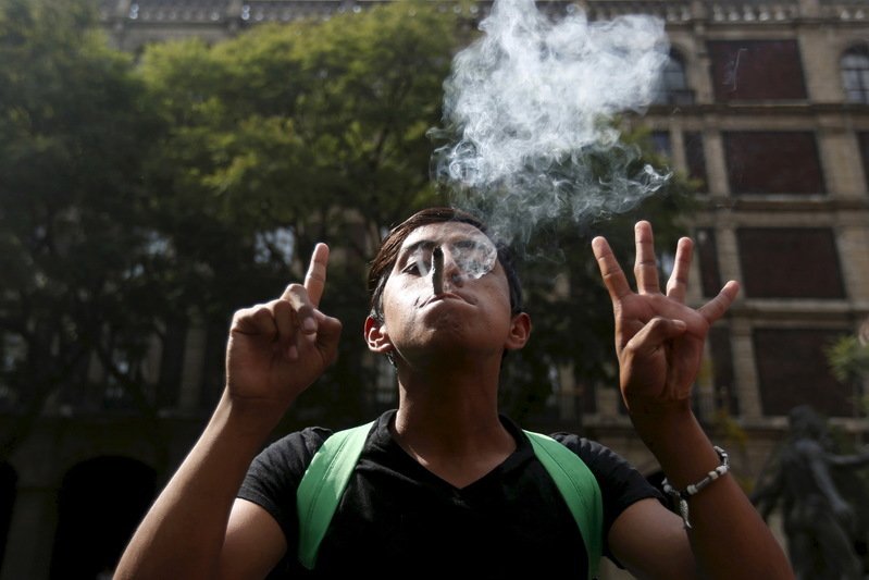 A man gestures during a demonstration in support of the legalization of marijuana outside the Supreme Court building in Mexico City in this