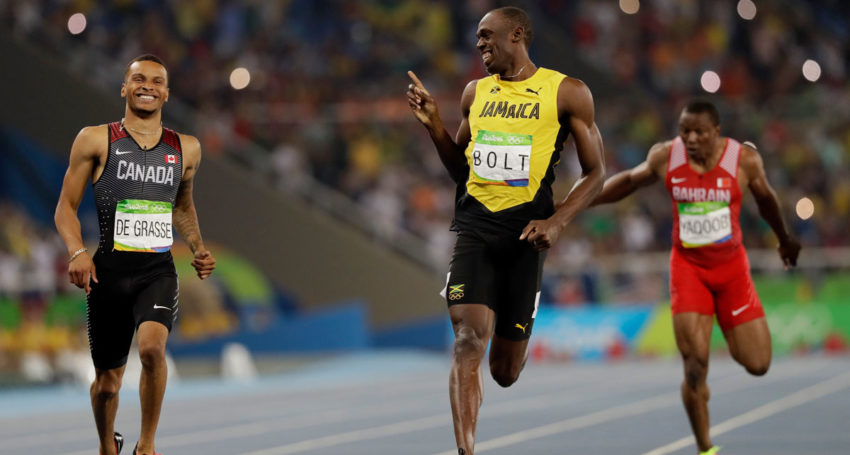 Usain Bolt passes Canada's Andre De Grasse in the men&#03