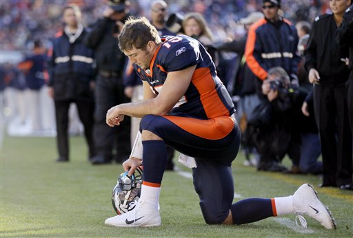 Tebow prays in the end zone before the start of the Broncos win over the Bears