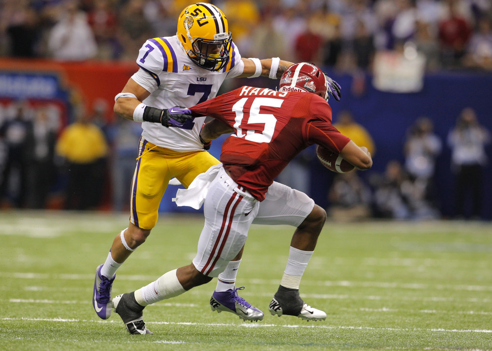 LSU Tigers CB Tyrann Mathieu grabs Alabama Crimson Tide WR Darius Hanks by the jersey during the first half of the Alabama Crimson Tides game versus the LSU Tigers in the Allstate BCS National Championship Game at the Mercedes