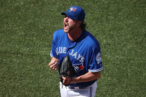 Jason Grilli #37 of the Toronto Blue Jays celebrates after getting the last out of the eighth inning during MLB game action against the Minnesota Twins