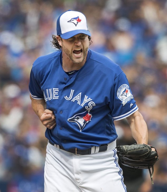 Toronto Blue Jays pitcher Jason Grilli reacts after striking out Houston Astros A.J. Reed to end the top of the seventh inning of a baseball game Sunday Au