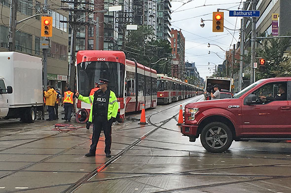 Toronto's starting to get its new streetcars but they're not always a welcome sight- especially this morning when one derailed at King and Bathurst