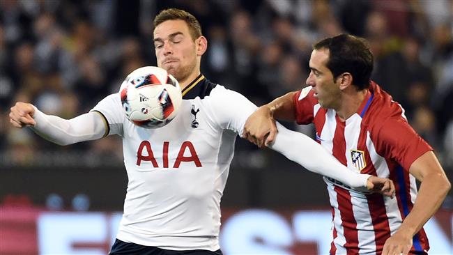 Tottenham Hotspur player Vincent Janssen fights for the ball with Atletico Madrid defender Diego Godin