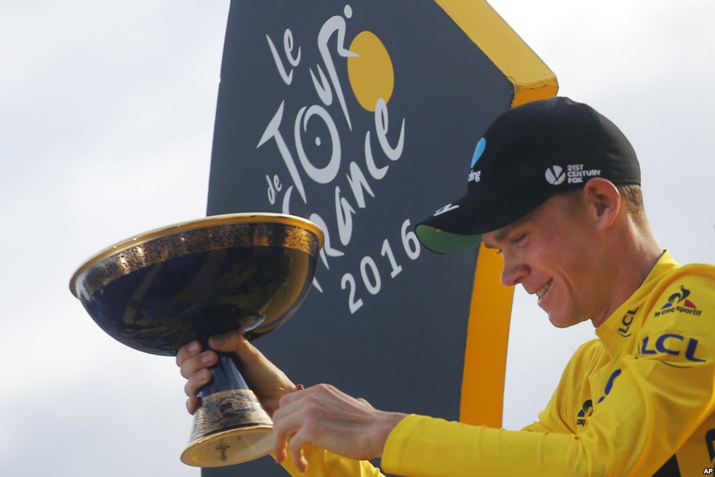 2016 Tour de France winner Chris Froome of Britain celebrates on the podium after the twenty-first and last stage of the Tour de France cycling race in Paris France Sunday