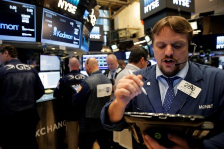 Traders work on the floor of the New York Stock Exchange in New York City U.S