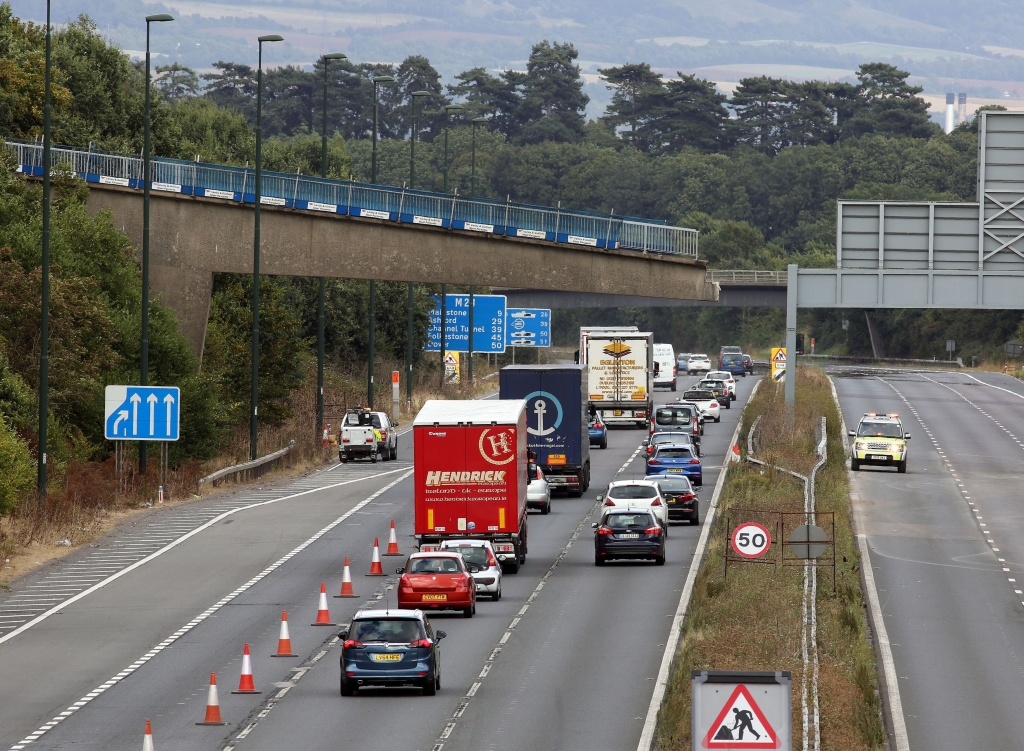 Traffic crawls along the M20 towards the coast under the bridge’s remaining half Steve Parsons  Press Association