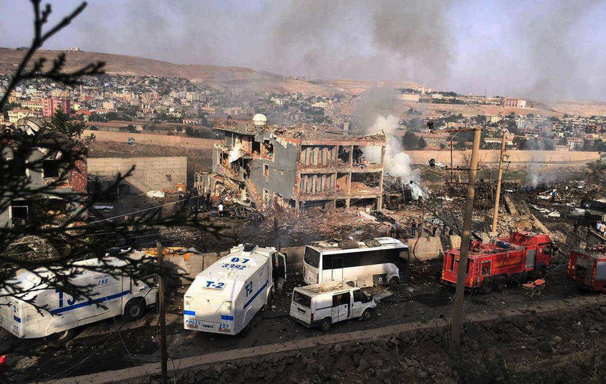 Kurdish suicide bomber kills at least 11 police officers at checkpoint