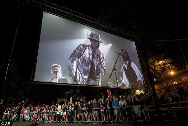 Trucking out Gord is displayed on a screen during a public viewing of the band's final concert in Halifax Nova Scotia