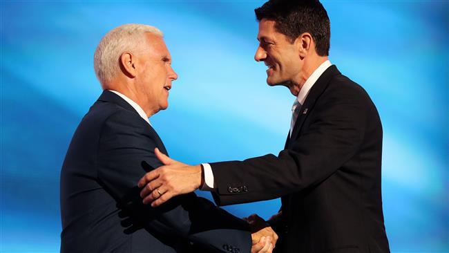 Speaker of the US House Paul Ryan shakes the hand of Republican vice presidential candidate Mike Pence as he walks on stage to deliver a speech on the third day of the Republican National Convention