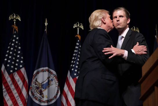 Republican presidential nominee Donald Trump embraces his son Eric at a campaign event in Ashburn Virginia. Trump's candidacy is continuing to tear away at the fabric of the party as the reality star's outlandish remarks and attacks on a Gold Star family