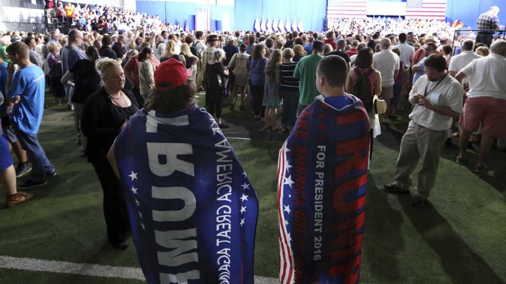 Brien Wedlock right and Matt Catanzaro are pretty much ignored as they wear Donald Trump capes at a campaign rally for Democratic presidential candidate Hillary Clinton Monday in Scranton Pennsylvania