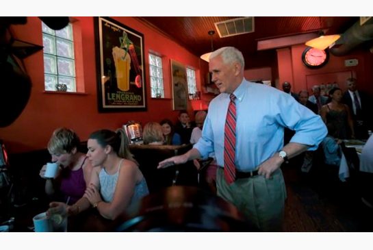 Republican vice presidential candidate Indiana Gov. Mike Pence right surprises patrons at Millie's Diner in Richmond Va. Saturday Aug. 27 2016 during an impromptu visit by the candidate to the popular restaurant. (Bob Brown  Richmond Times Dispatch