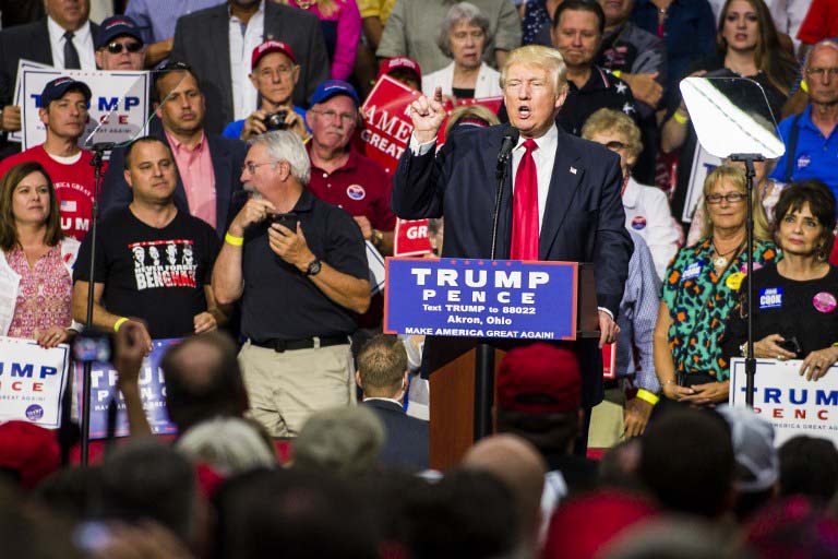 Republican Presidential candidate Donald Trump addresses supporters at the James A. Rhodes Arena