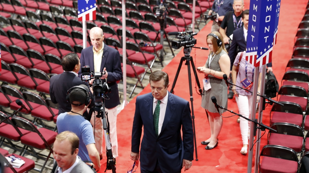 Trump campaign Chairman Paul Manafort walks off the floor of the Republican National Convention last month after talking to reporters