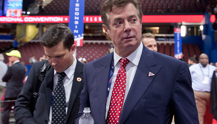 Trump campaign chairman Paul Manafort walks around the convention floor before the opening session of the Republican National Convention in Cleveland