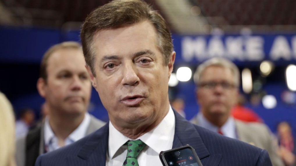 Trump campaign chairman Paul Manafort talks to reporters on the floor of the Republican National Convention at Quicken Loans Arena in Cleveland