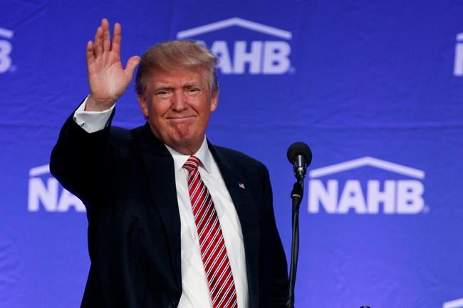 Republican presidential candidate Donald Trump waves after speaking to the National Association of Home Builders Thursday Aug. 11 2016 in Miami Beach Fla